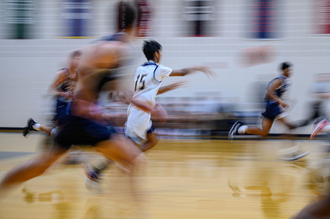 A blurry image of a basketball game.