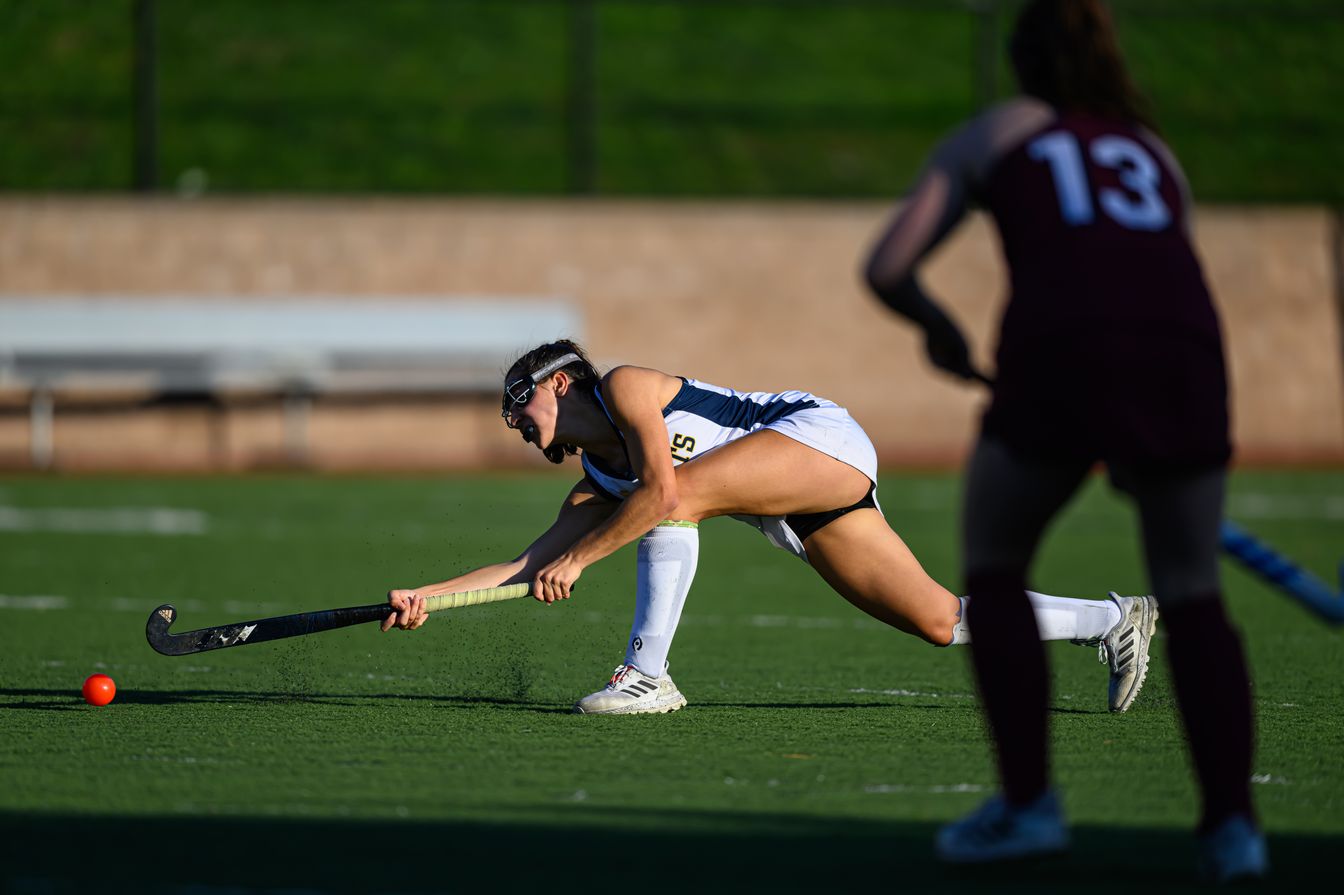 field hockey team playing.