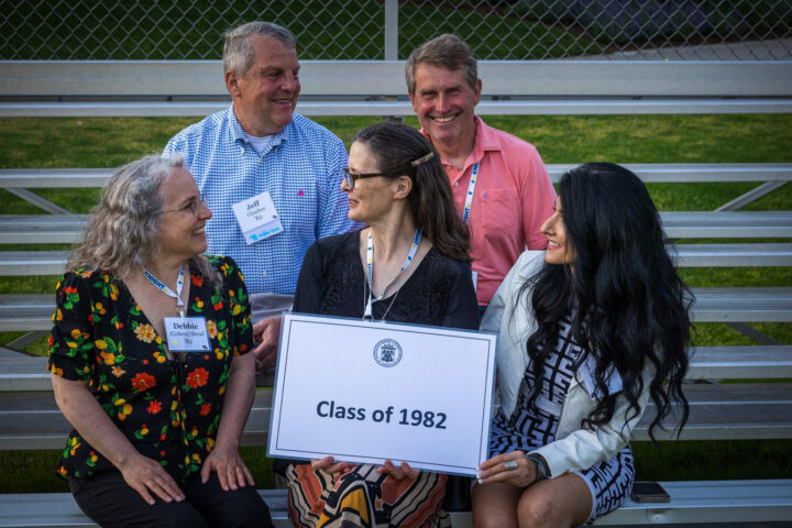 alumni holding class of 1982 sign.