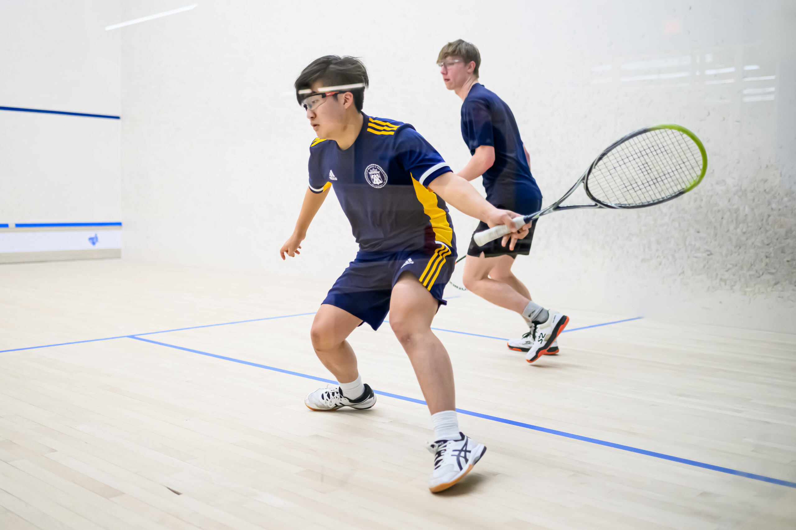 boys playing squash.