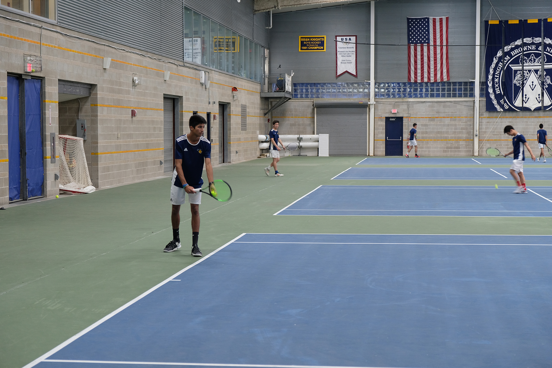 boys playing tennis.