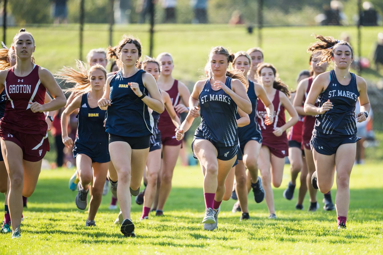 girls cross country team running.