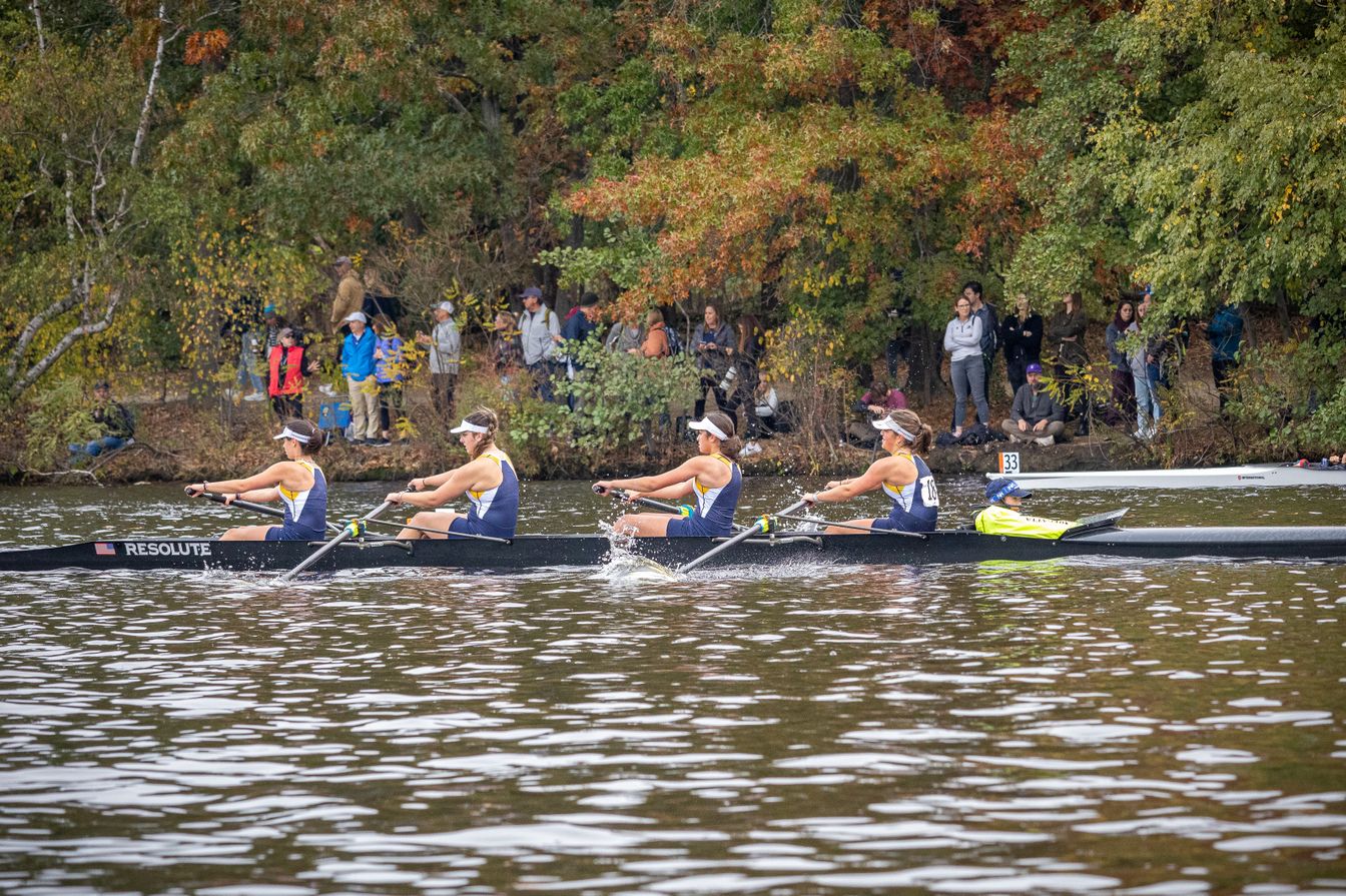 girls crew team on water.