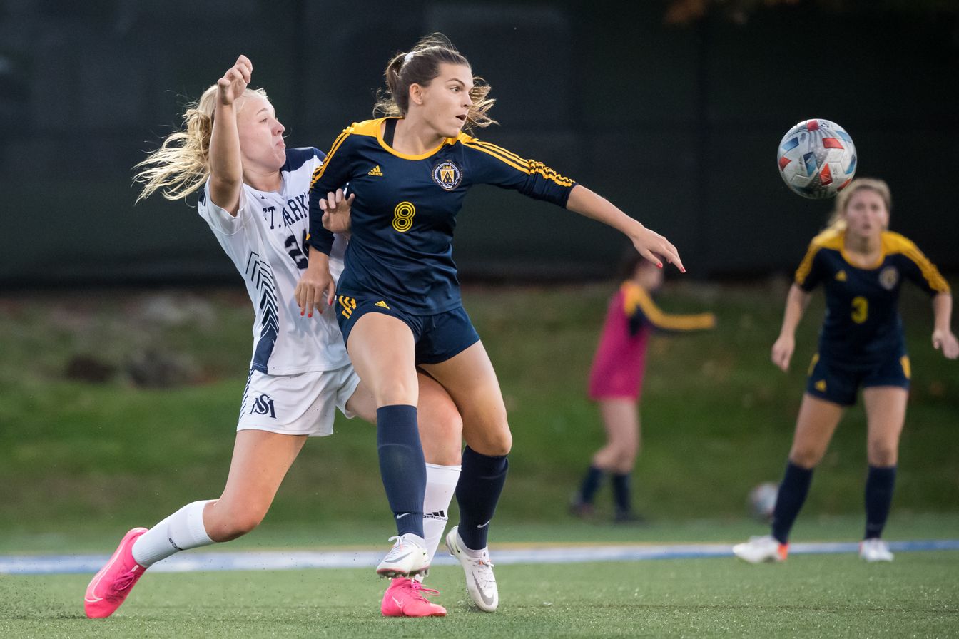 girls soccer team in action.