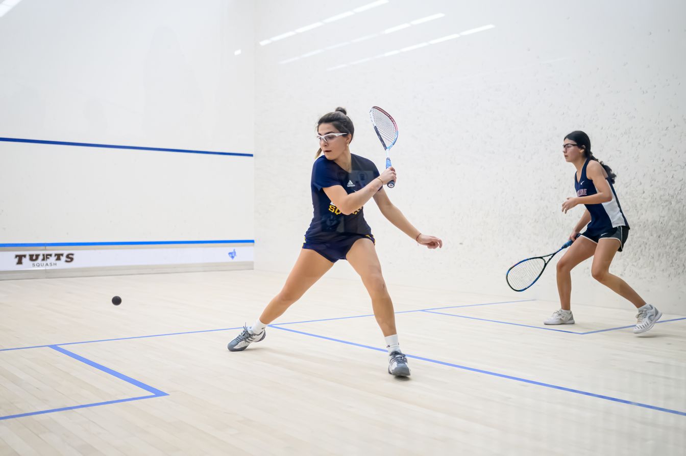 girls playing squash.