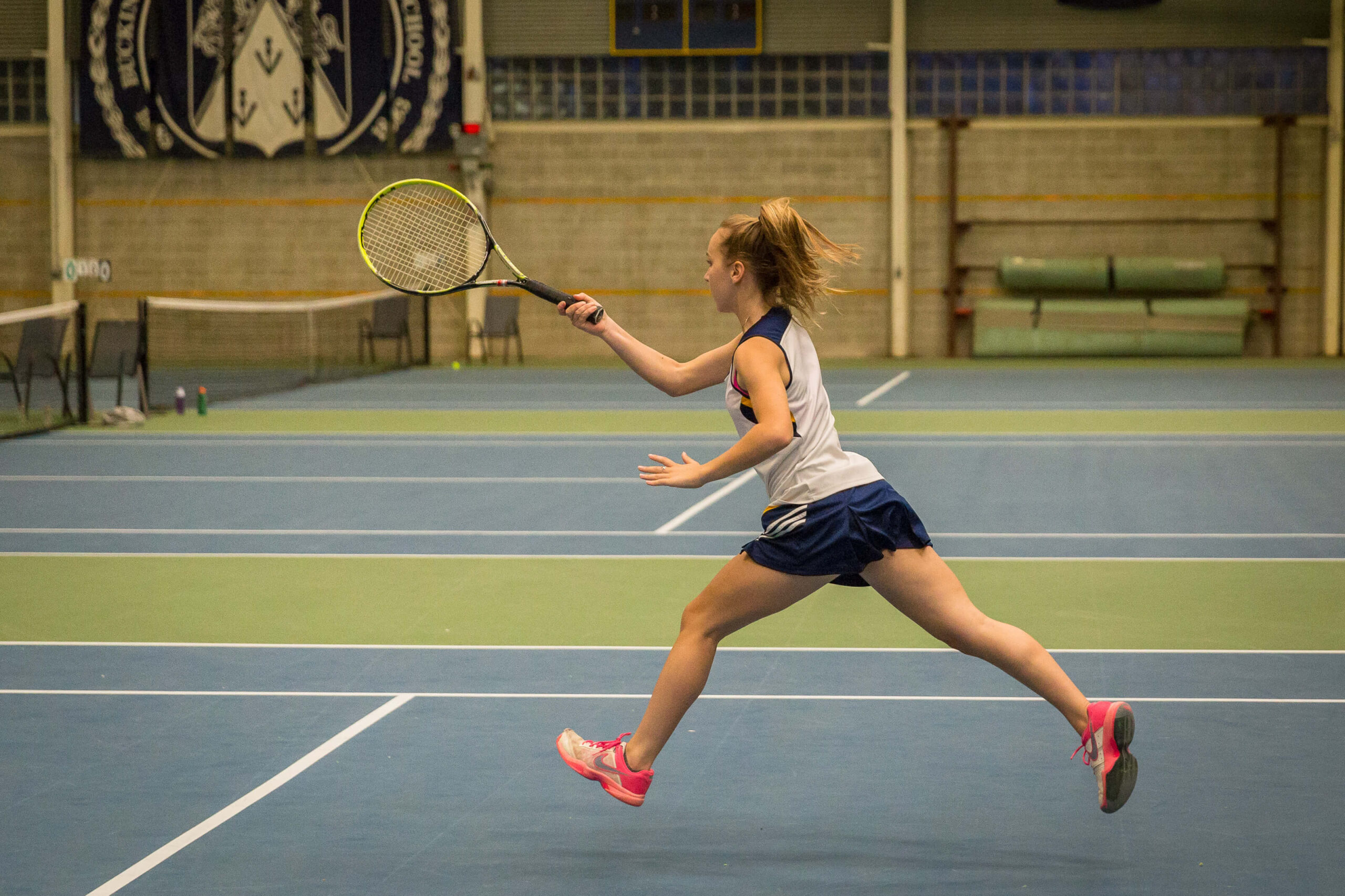 girl in tennis match.