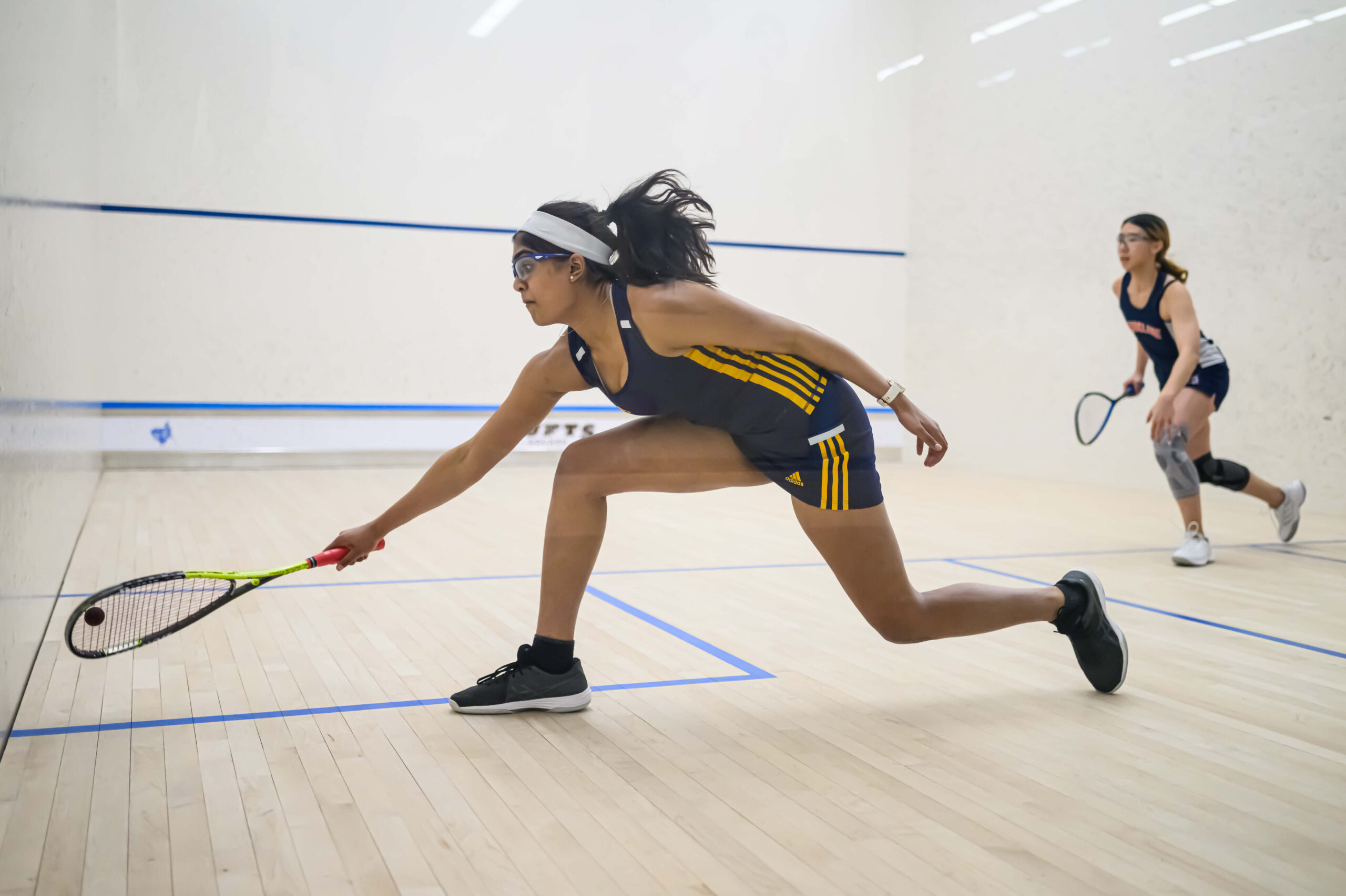 girl playing squash.