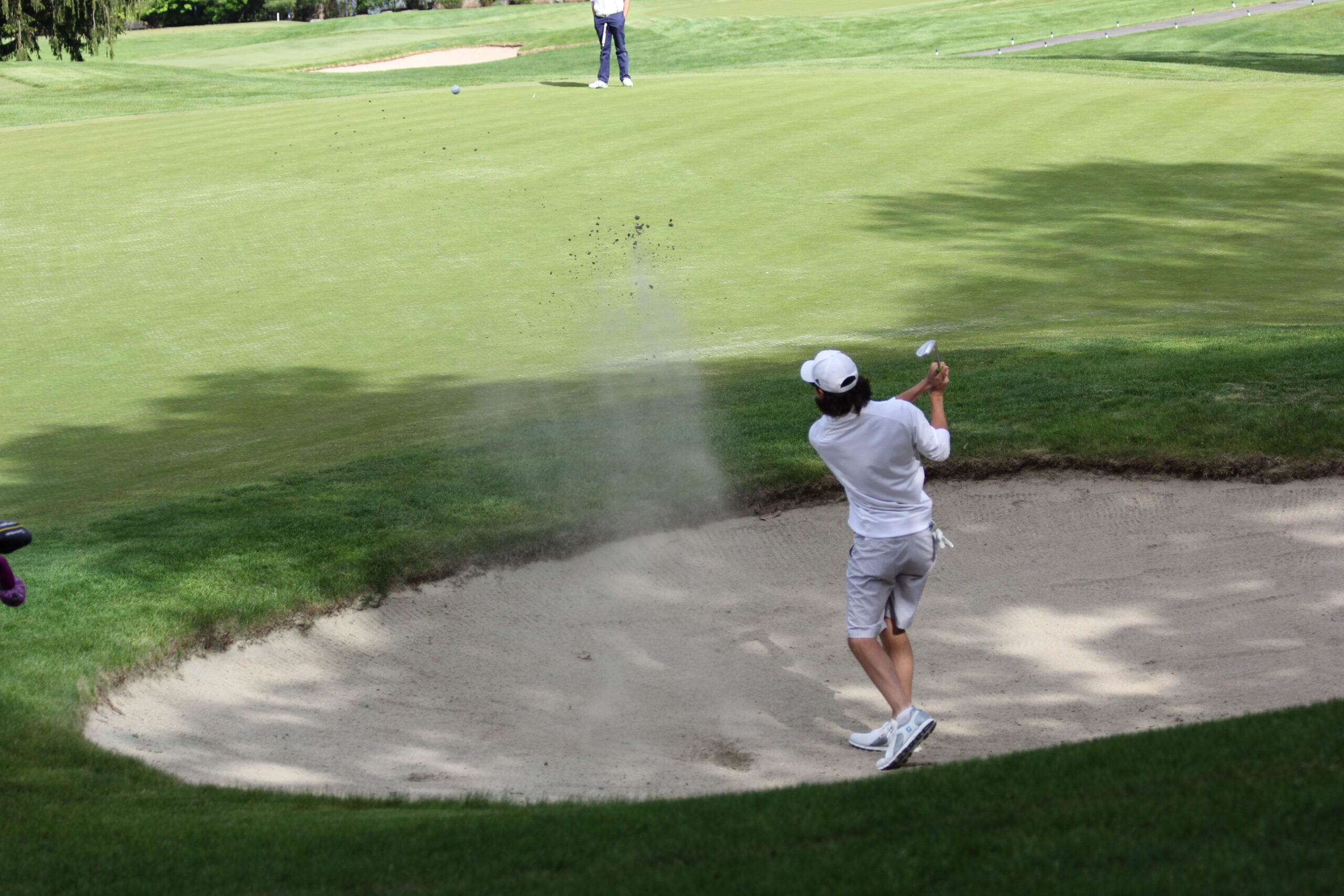 golfer in bunker.