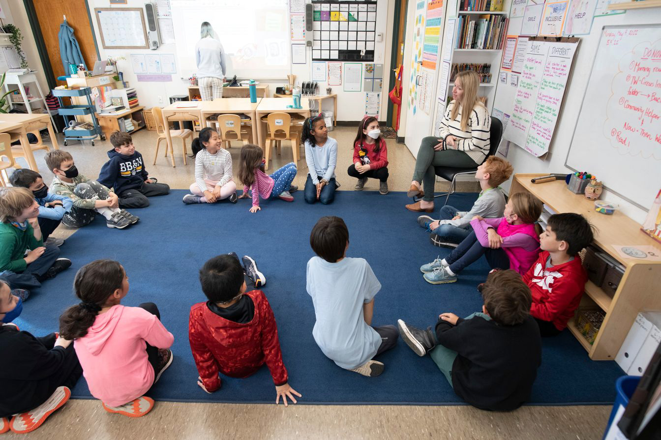 kids sitting on floor in class.