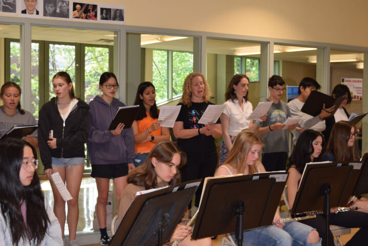 students rehearsing in choir.