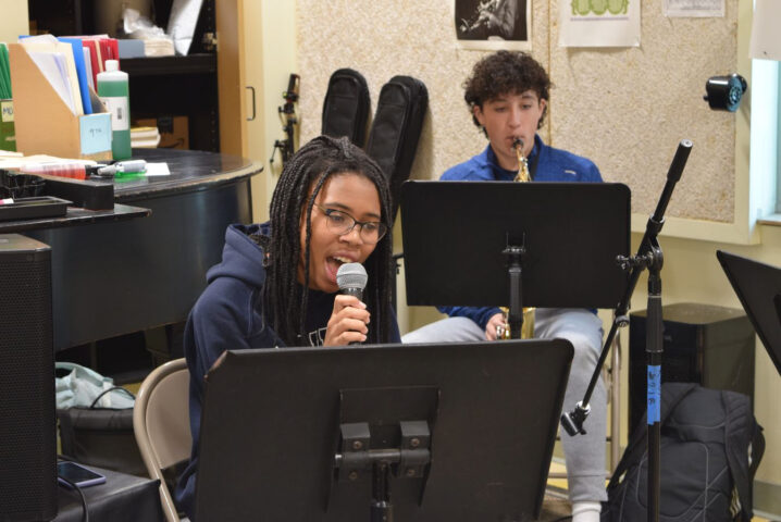 students rehearsing in music class.