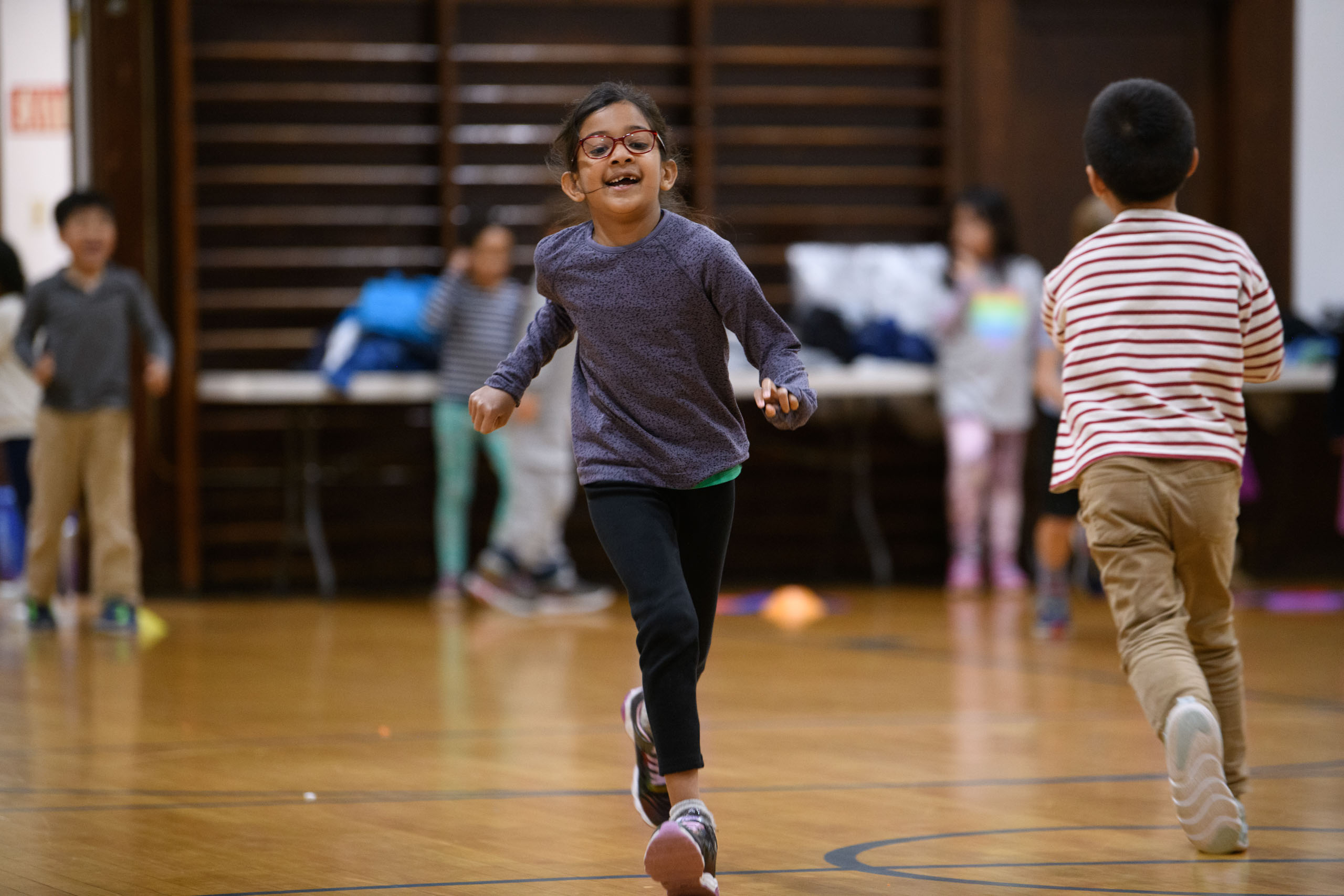 student running in gym class.