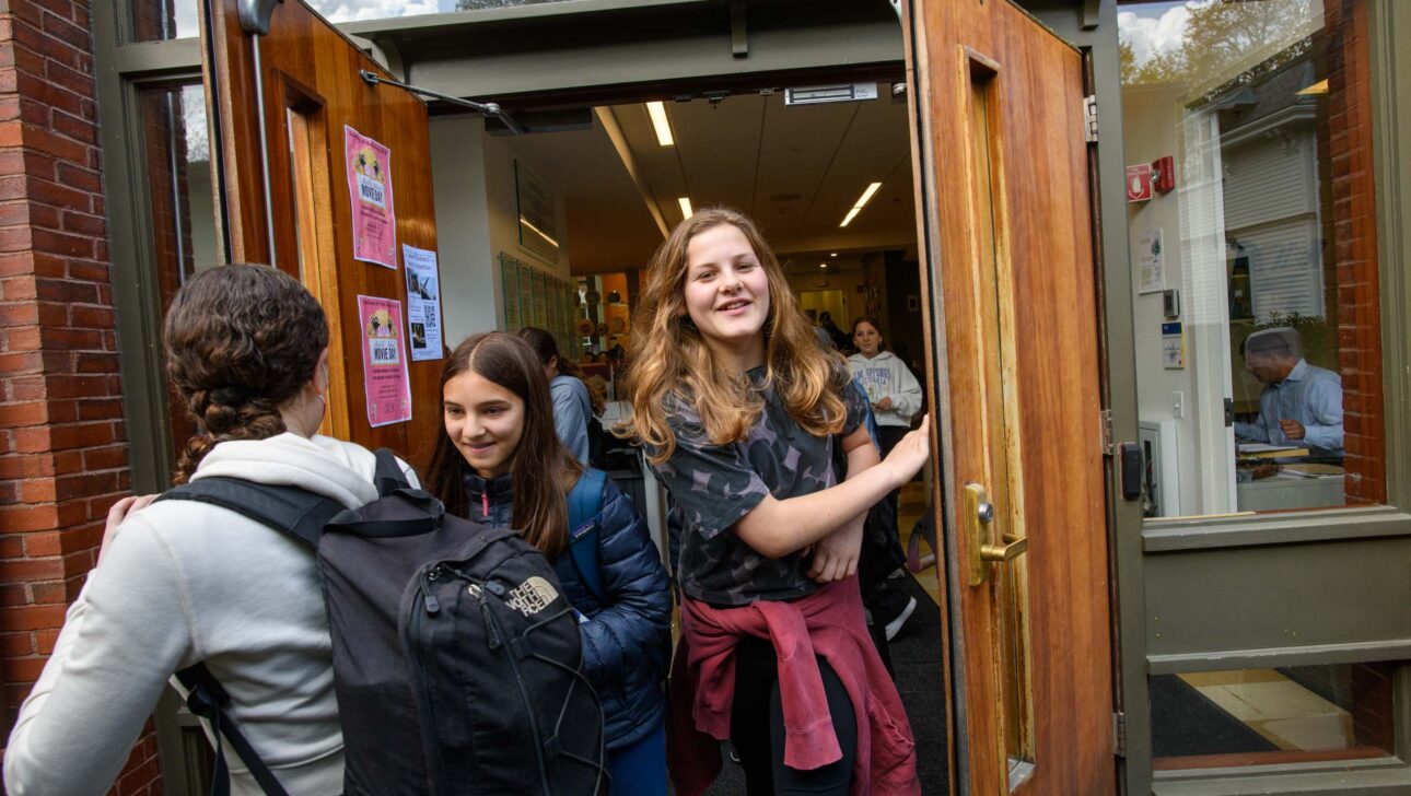students opening door.