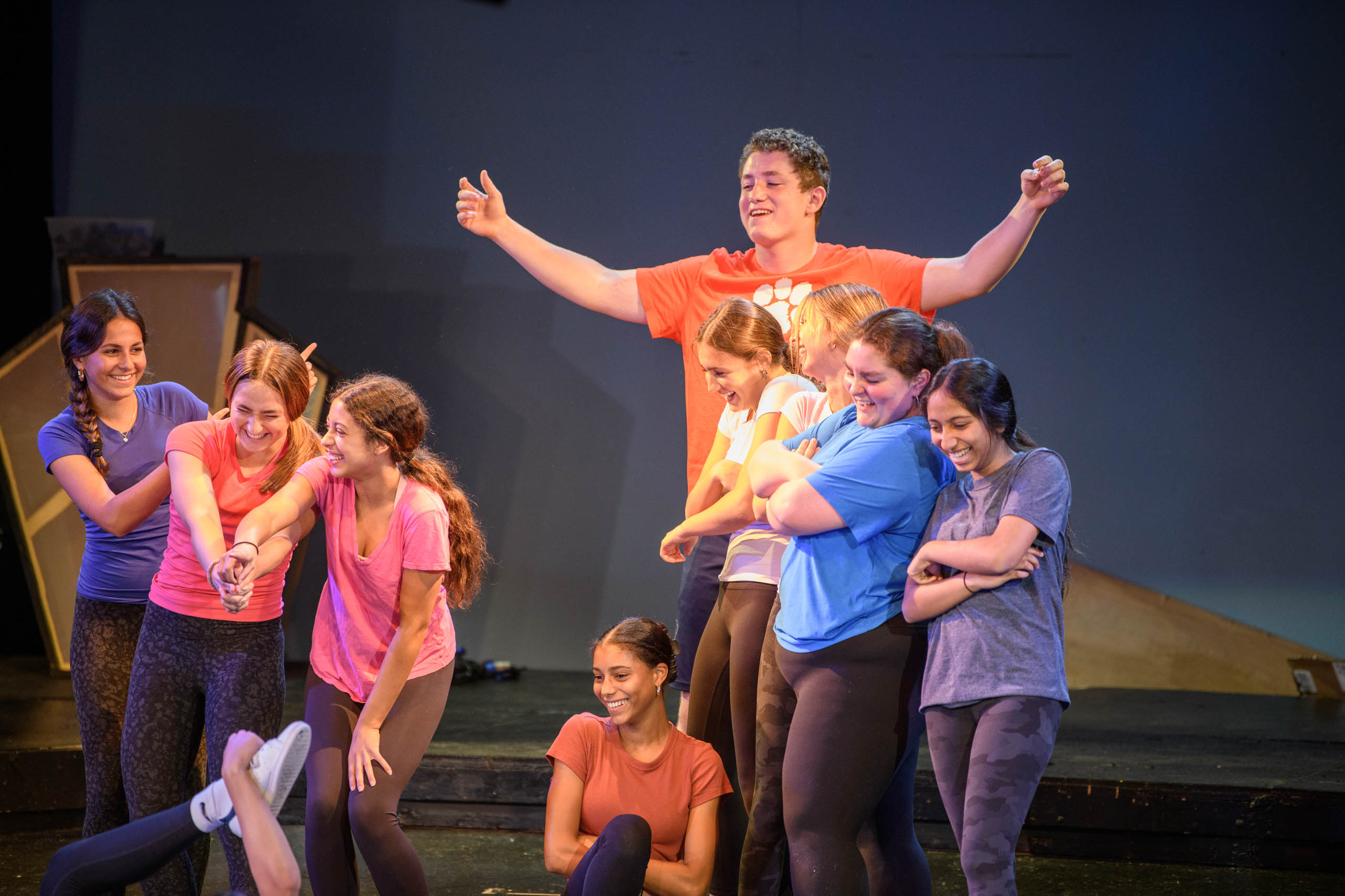 students performing on stage.
