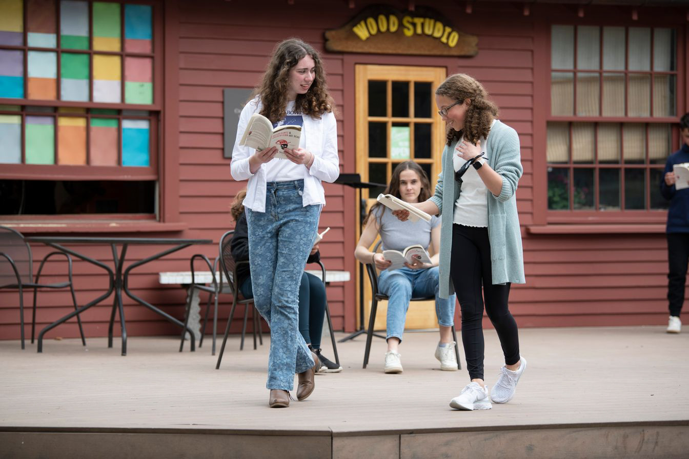 students acting on stage.