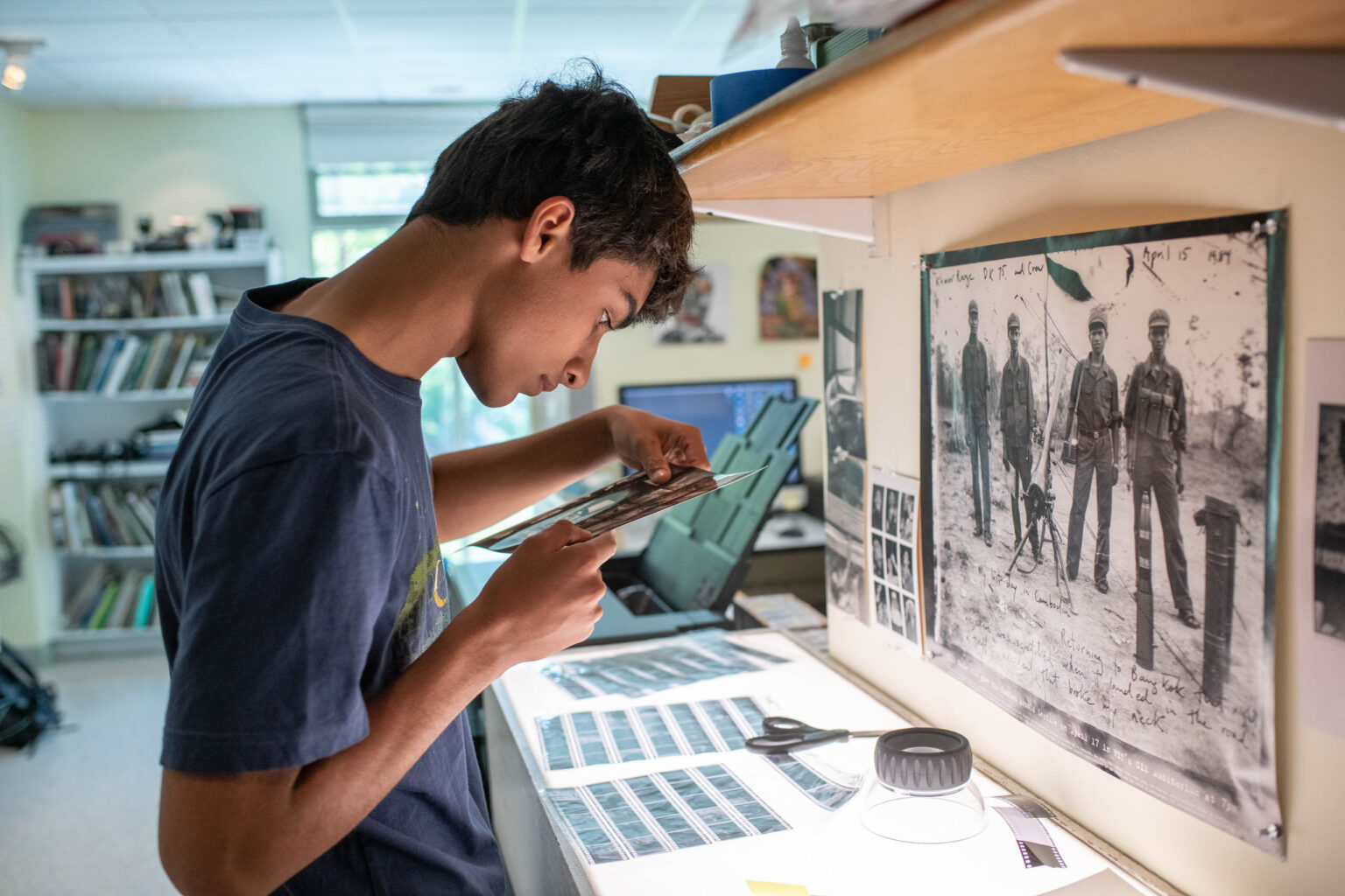 student looking at film.