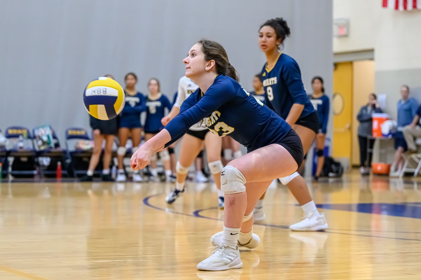 volleyball player returning serve.