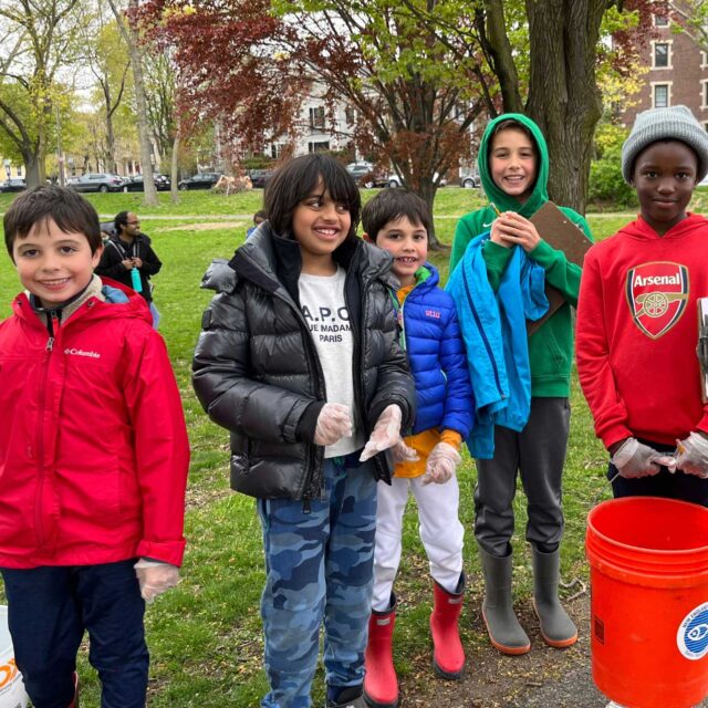 students cleaning up along the charles river.