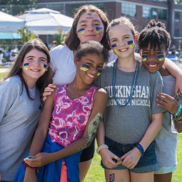 Students with painted faces.