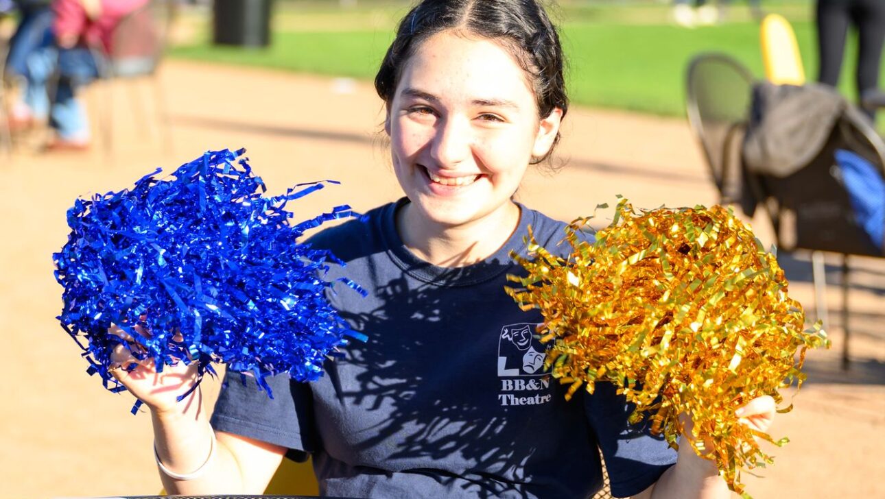 girl with pom poms